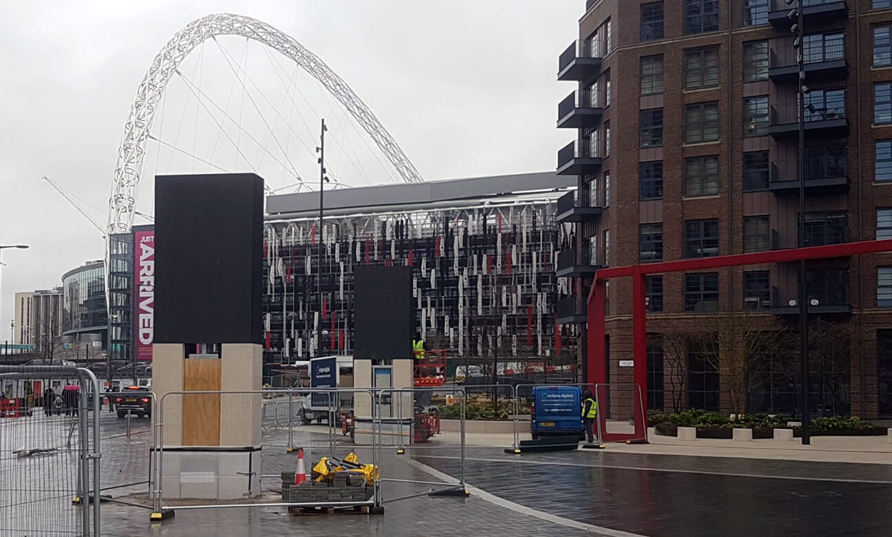 Eclipse Digital Media - Digital Signage and AV Solutions - Wembley Park - White Horse Square LED Totems - Installing with Arch